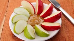 Healthy snacks for weight loss on the go - apple slices with peanut butter